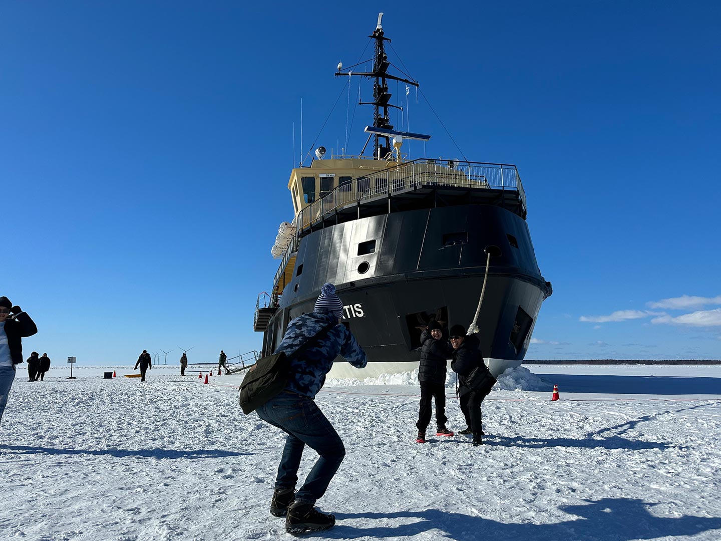 icebreaker cruise - people walking on the ice of the frozen sea